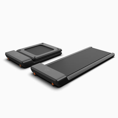 Two black portable treadmills on a white background