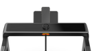 Black treadmill with a screen and control panel on a white background