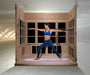 Woman practicing yoga in a wooden infrared sauna