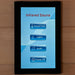 Touchscreen control panel for an infrared sauna on a wooden surface