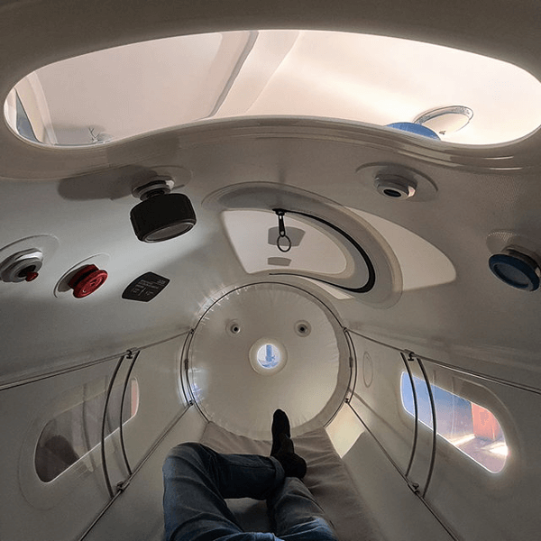 Person lying inside an Oxyrevo hyperbaric chamber 