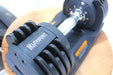 Dumbbell with 'Lifesmart' branding on a wooden surface