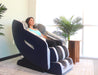 Woman relaxing in a massage chair in a modern room with plants