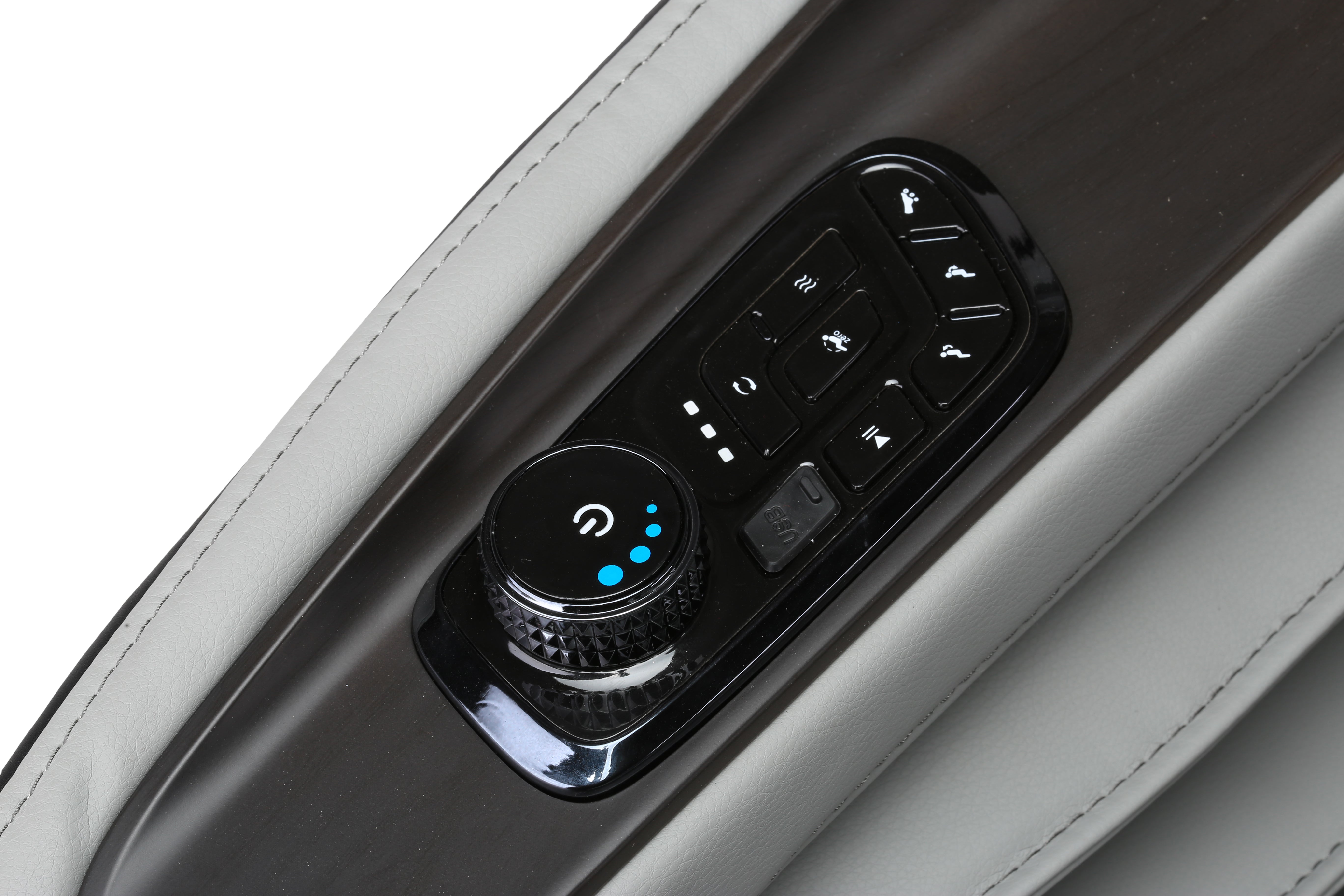 Close-up of a massage chair control panel with buttons and a knob on a white background
