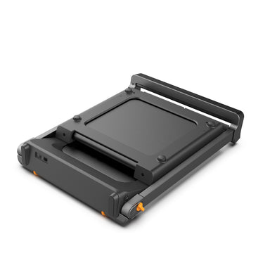 Black treadmill folded on a white background