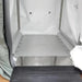 Inside of a Sitting hyperbaric chamber with a gray floor and a black wheelchair ramp