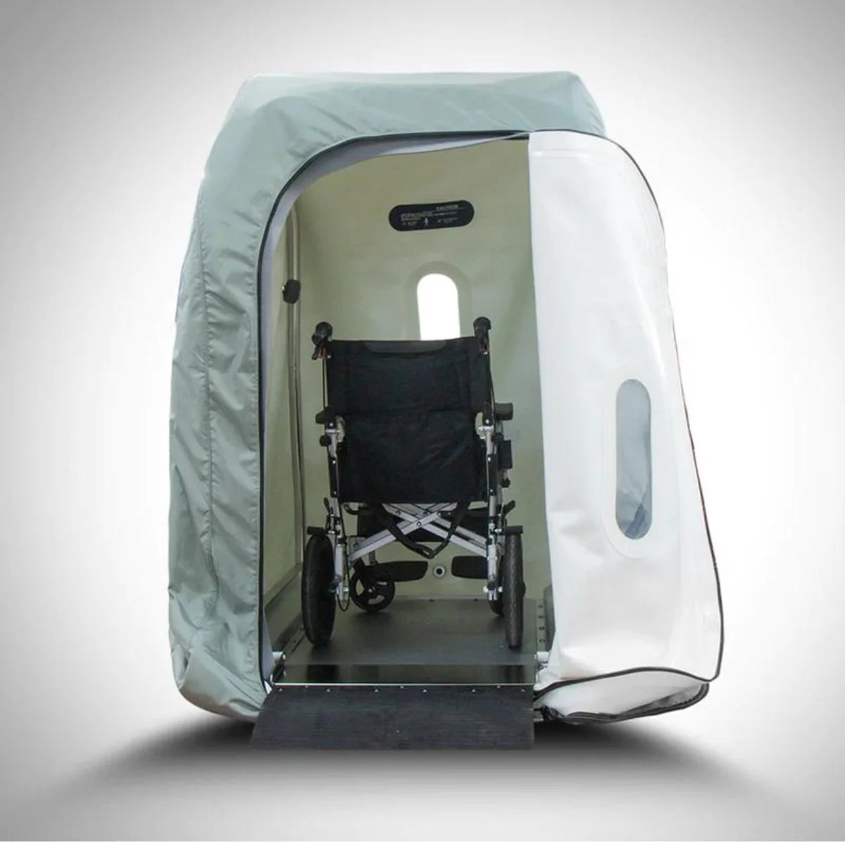 Sitting hyperbaric chamber with a wheelchair inside on a white background