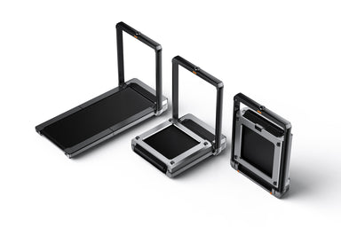 Three black folding treadmills with metallic frames on a white background